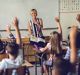Teacher in class full of students