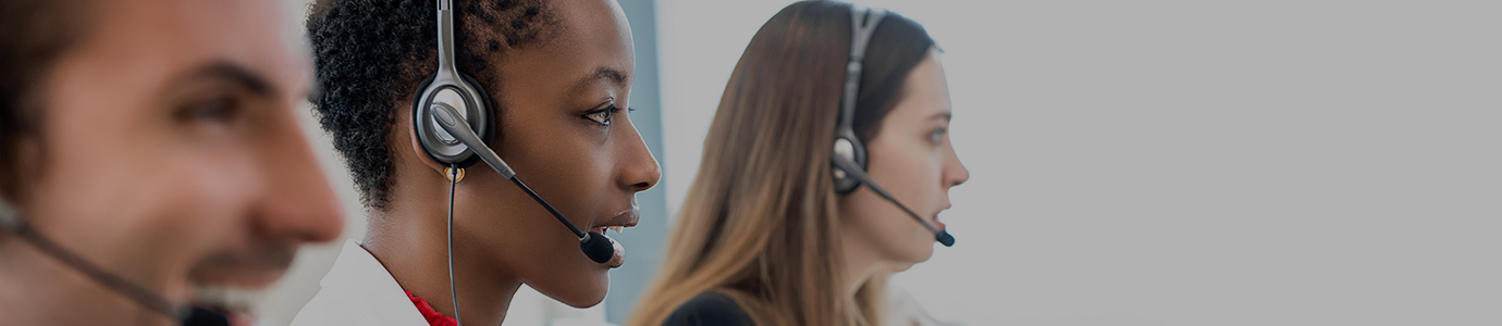 People at call centre wearing headsets